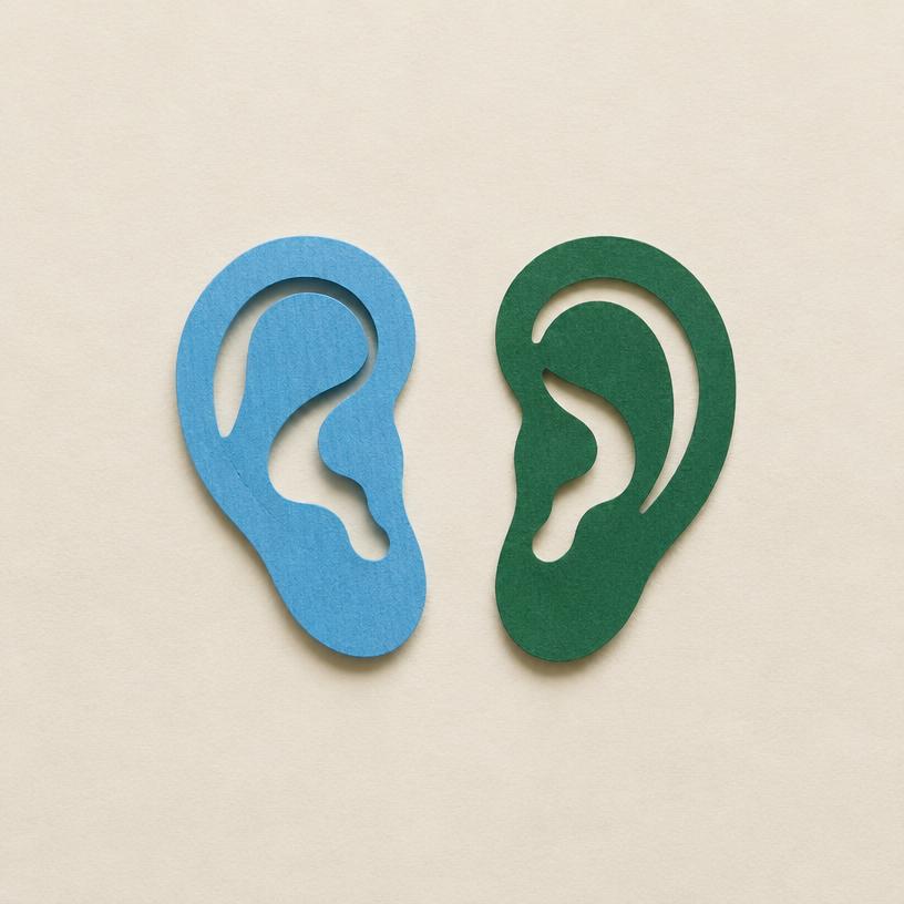 Two paper-cut ears in sky blue and deep green